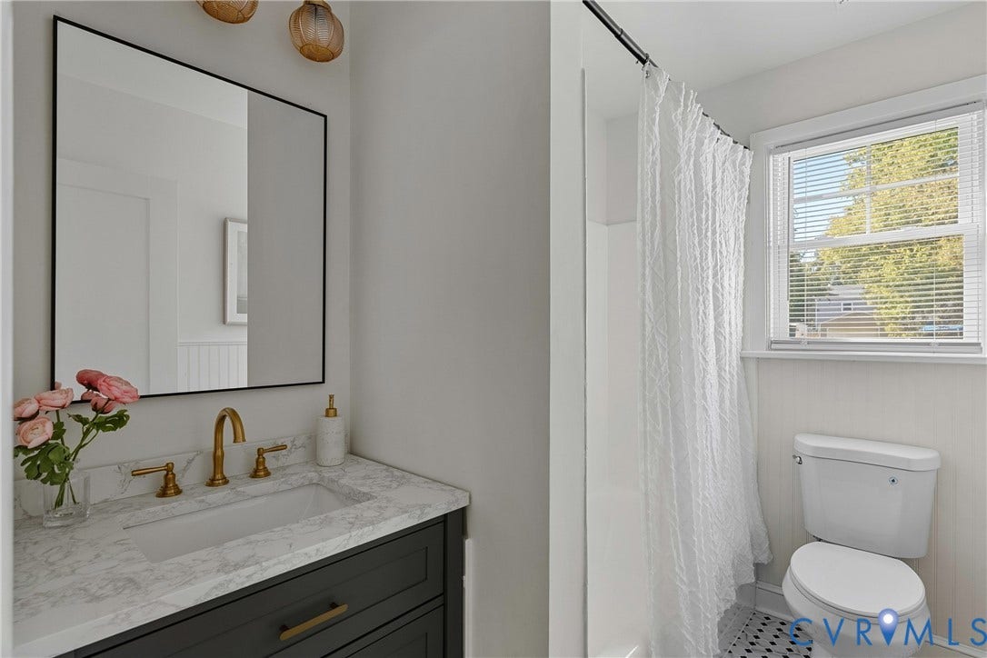 5304 Gillespie Avenue, Henrico, VA 23228 Vanity with a stone finish countertop, integrated rectangular sink, and gold-finish hardware