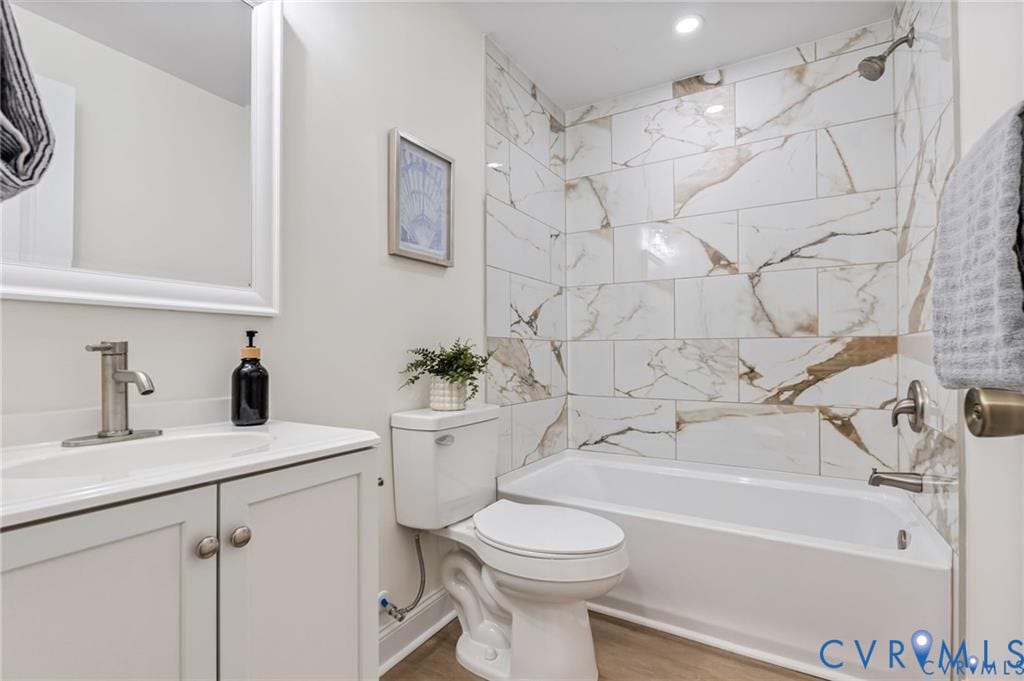 White vanity with a brushed nickel faucet and undermount sink