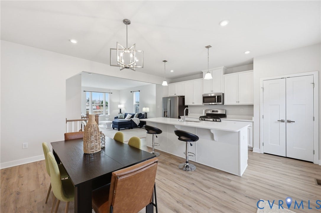 Another view of expansive kitchen and dining area.
