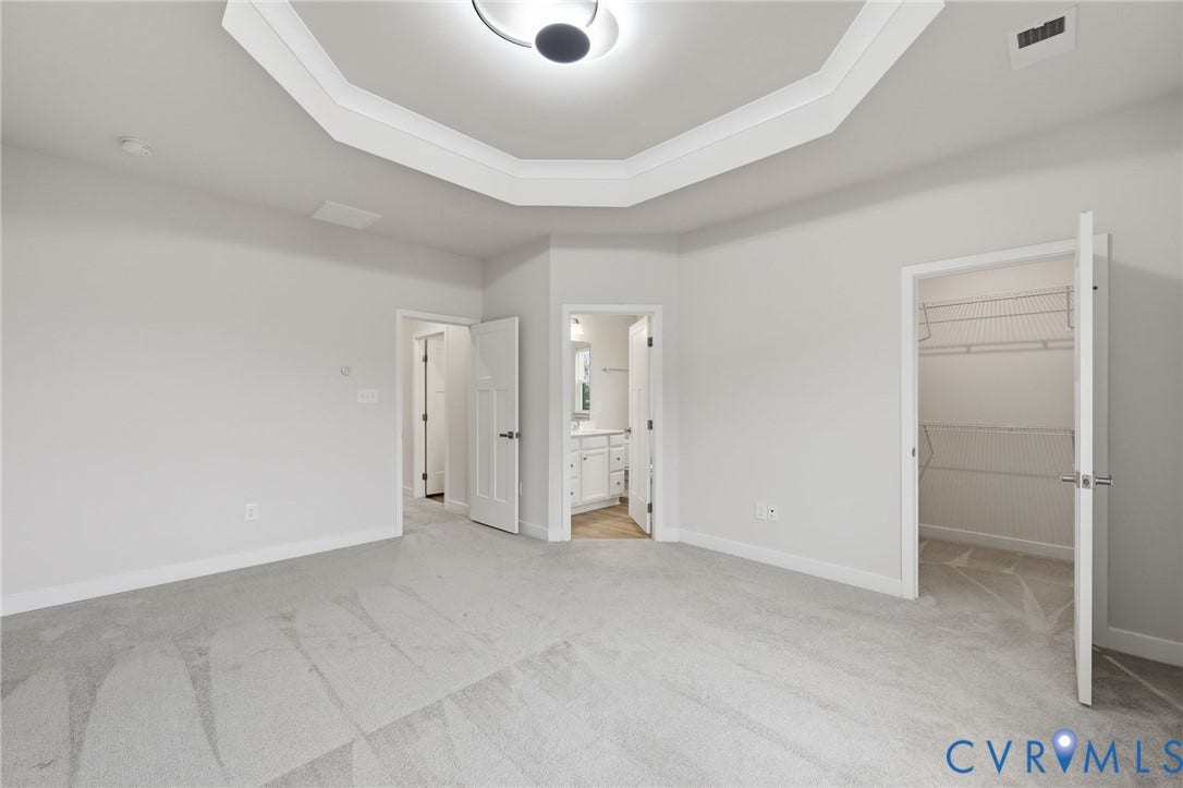 Another view showcasing ensuite and walk in closet.