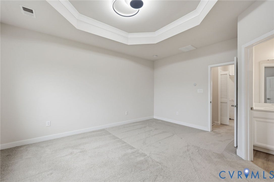 Primary Bedroom with tray ceiling.