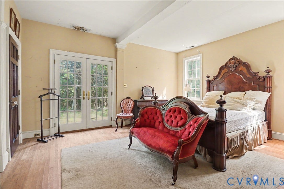 French doors with glass panes, wood-finish flooring, and a single window