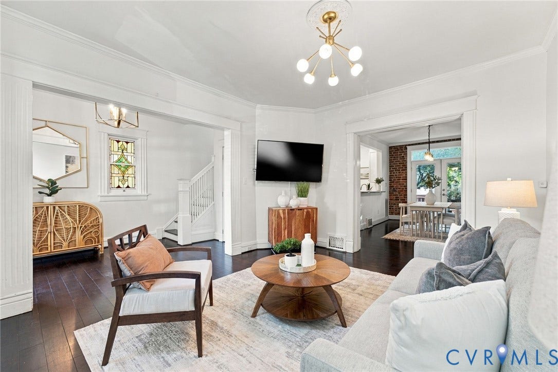 107 N Allen Avenue, The Fan, Richmond, VA 23220 Living area featuring dark hardwood flooring, crown molding, a decorative ceiling medallion with a multi-light fixture, and a stained-glass window