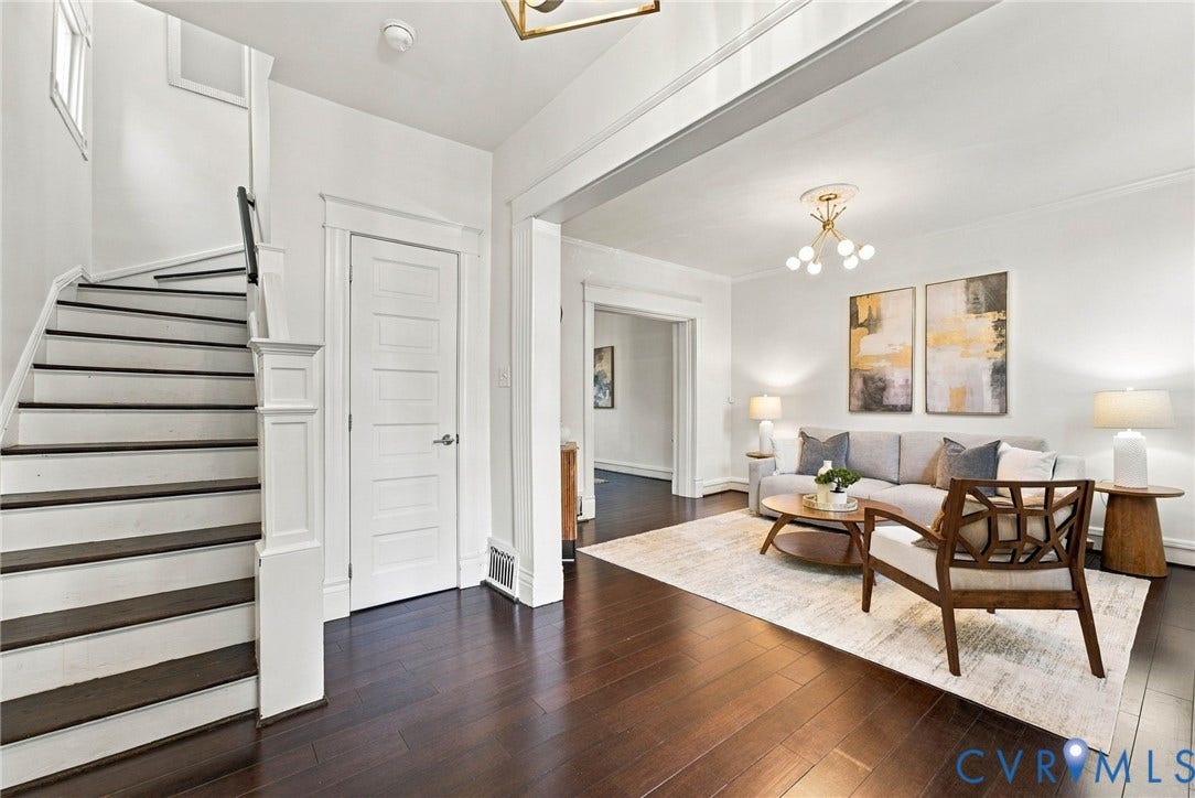 107 N Allen Avenue, The Fan, Richmond, VA 23220 Entryway featuring wood-finish flooring, a staircase with decorative millwork, five-panel interior doors, and custom multi-arm ceiling light fixtures