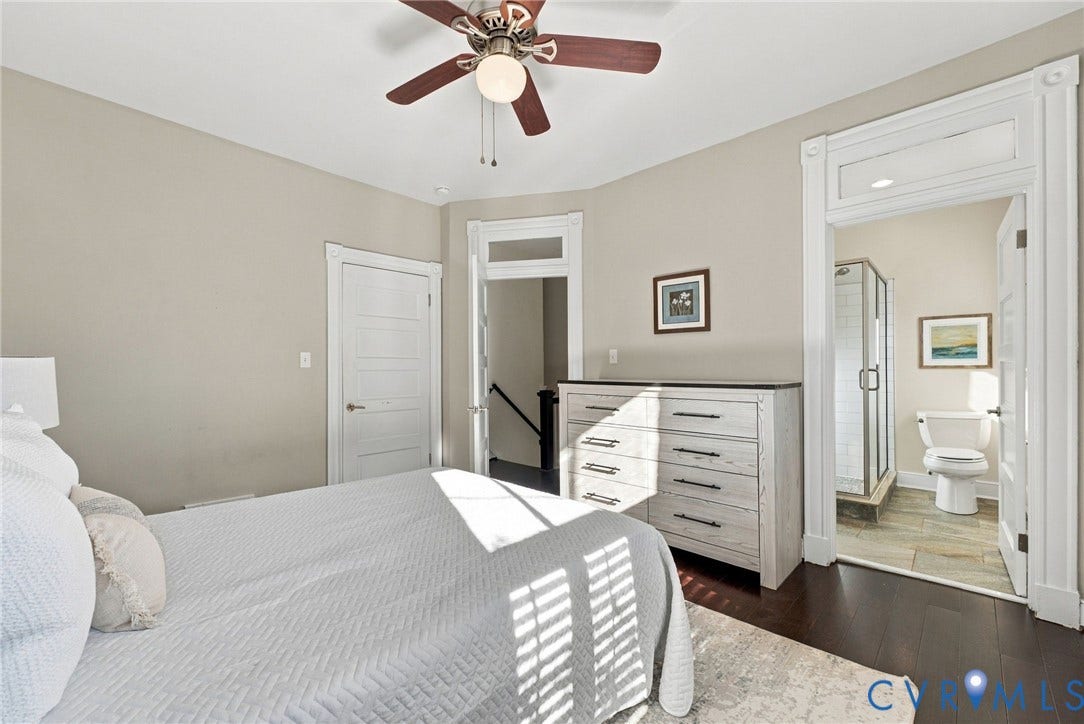 107 N Allen Avenue, The Fan, Richmond, VA 23220 Interior space featuring dark wood-finish flooring, high ceilings with a central ceiling fan, and classic door frames with integrated transoms