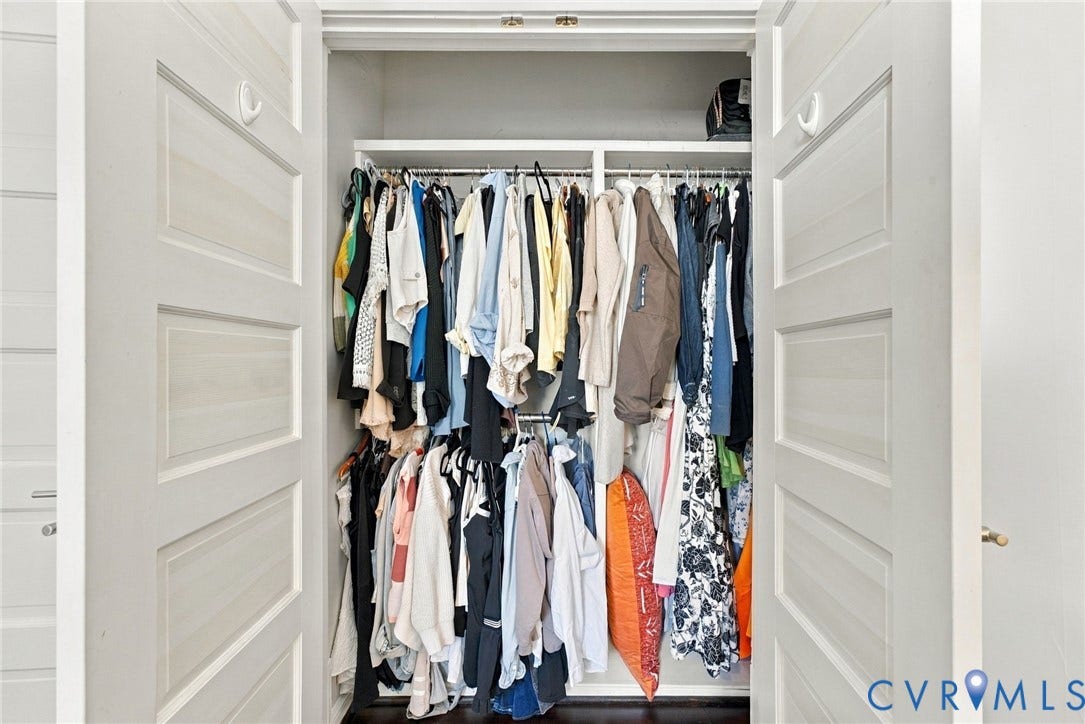 107 N Allen Avenue, The Fan, Richmond, VA 23220 Storage closet featuring dual shaker-style doors, integrated hanging rods, and built-in upper shelving