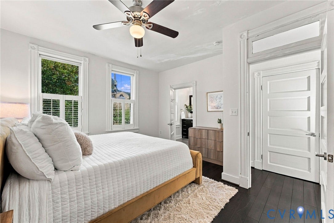 107 N Allen Avenue, The Fan, Richmond, VA 23220 Dark wood-finish flooring, high ceilings with a central ceiling fan, classic five-panel doors, transom window, and white plantation shutters