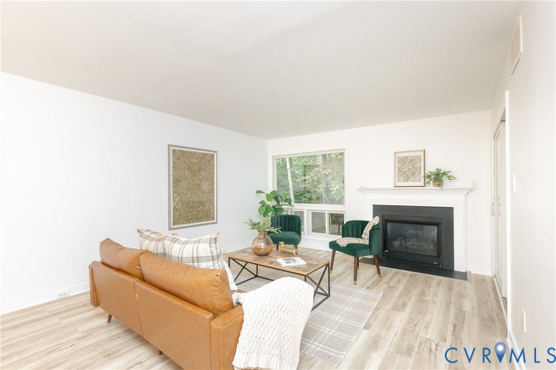 10404 Iron Mill Road, Chesterfield, VA 23235 White walls, wood-finish flooring, and a picture window with exterior views.