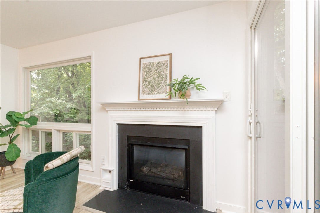 10404 Iron Mill Road, Chesterfield, VA 23235 Built-in fireplace with a white mantel and black stone hearth