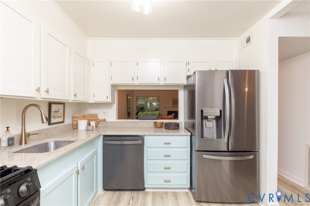 10404 Iron Mill Road, Chesterfield, VA 23235 White upper cabinetry, light blue lower cabintry, with gold-tone hardware.
