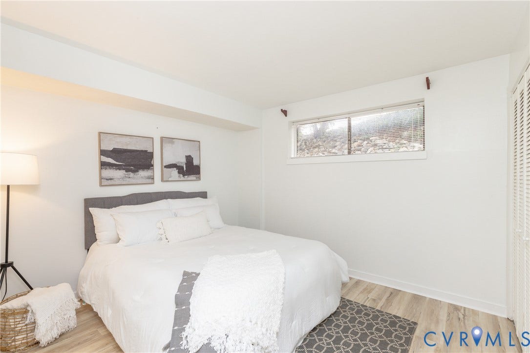 10404 Iron Mill Road, Chesterfield, VA 23235 Recessed window, white walls, wood-finish flooring, white louvered closet doors