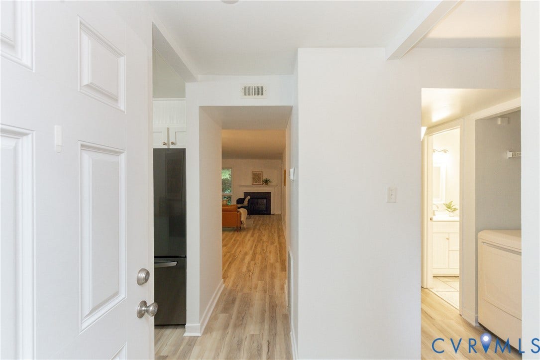 10404 Iron Mill Road, Chesterfield, VA 23235 Wood-finish flooring throughout, bright white walls..