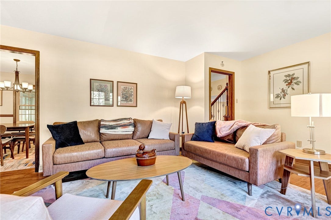 11410 Driscoll Road, Chester, VA 23831 Living area featuring wood-finish flooring and wood-trimmed door casings