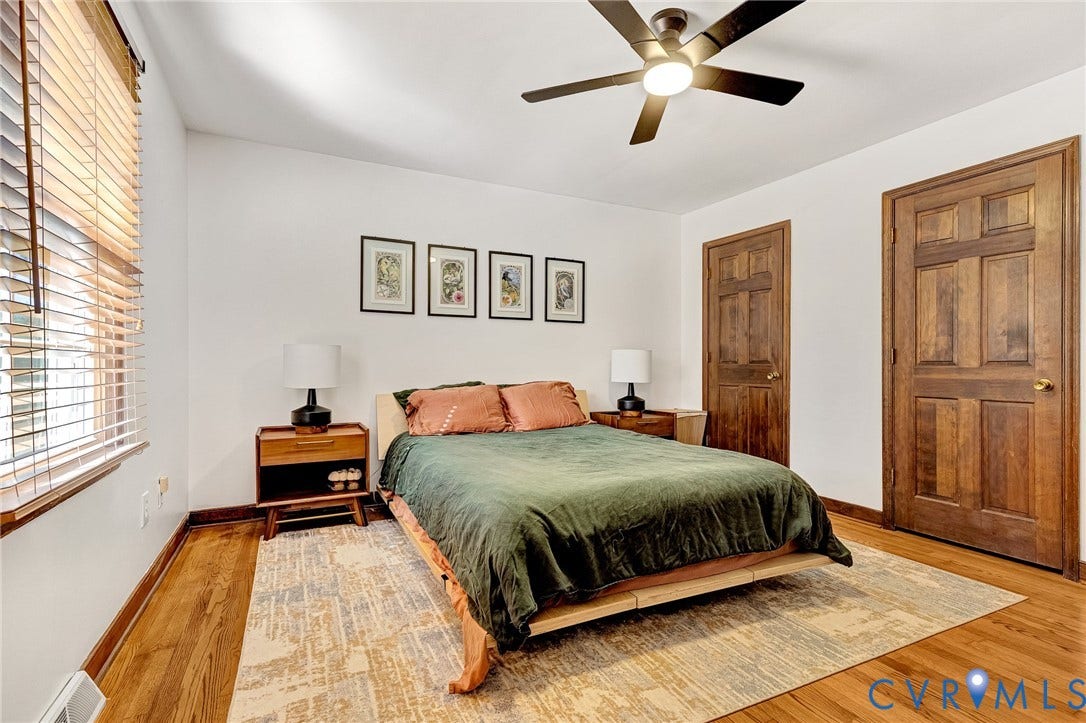 11410 Driscoll Road, Chester, VA 23831 Wood-finish flooring, multi-pane wood doors, and a ceiling fan with integrated lighting