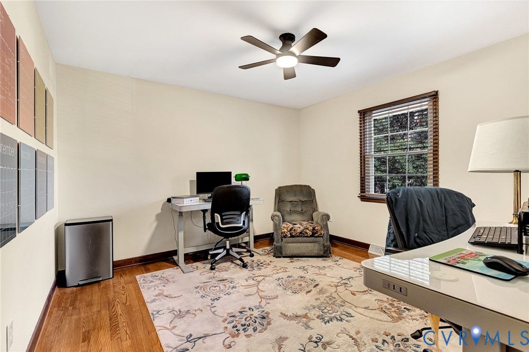 11410 Driscoll Road, Chester, VA 23831 Wood-finish flooring, multi-pane window with wood-slat blinds, and overhead ceiling fan with integrated lighting
