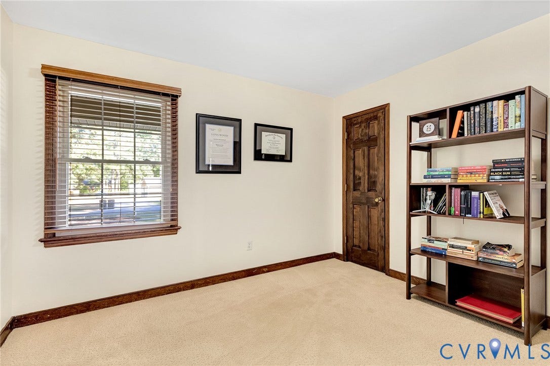 11410 Driscoll Road, Chester, VA 23831 Room featuring neutral wall-to-wall carpeting, wood-trimmed windows with horizontal blinds, and a six-panel wood door