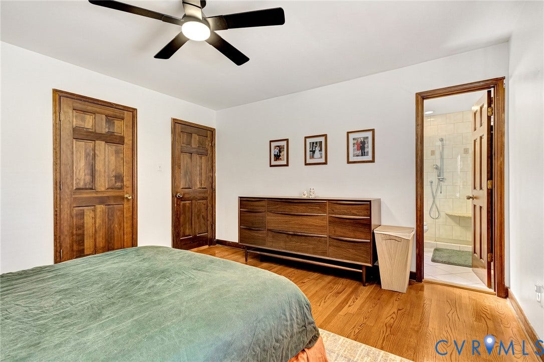 11410 Driscoll Road, Chester, VA 23831 Wood-finish flooring, multi-panel wood doors, and a ceiling-mounted light fixture with fan