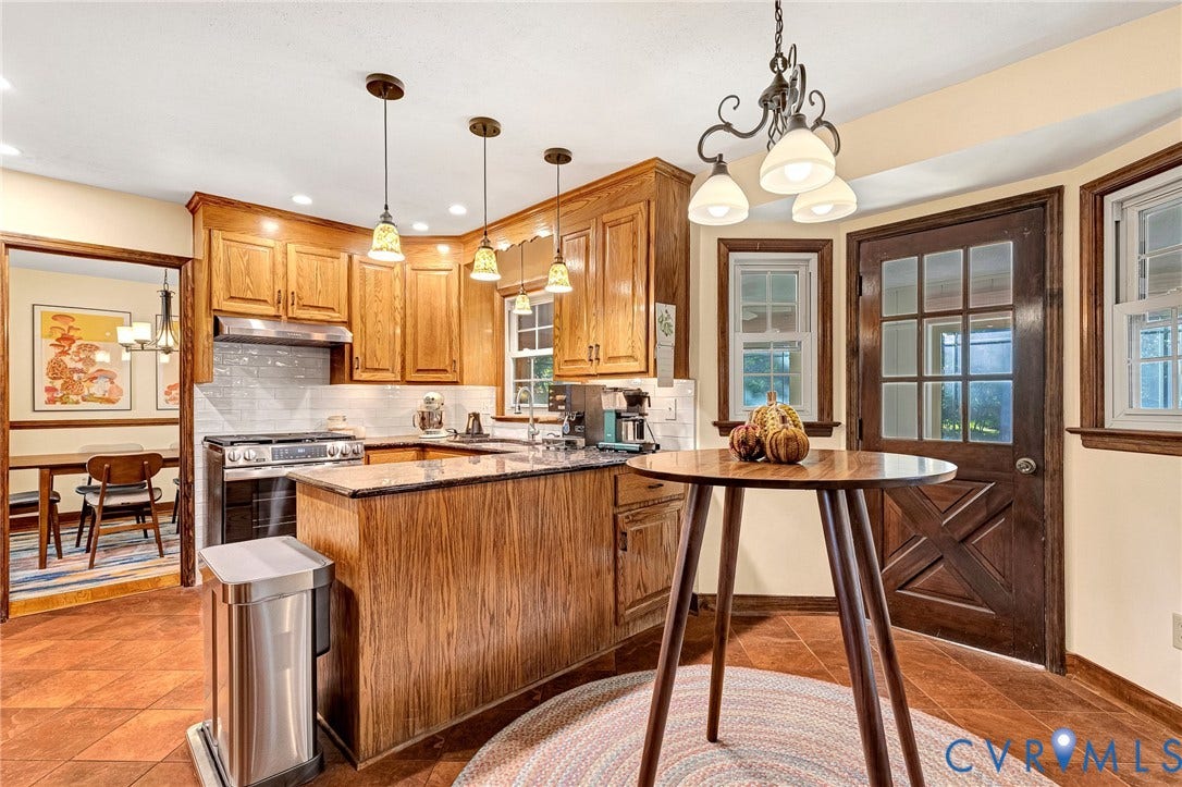 11410 Driscoll Road, Chester, VA 23831 Kitchen featuring wood cabinetry, stone countertops, a tiled backsplash, tile flooring, and a multi-pane wood-finish exterior door