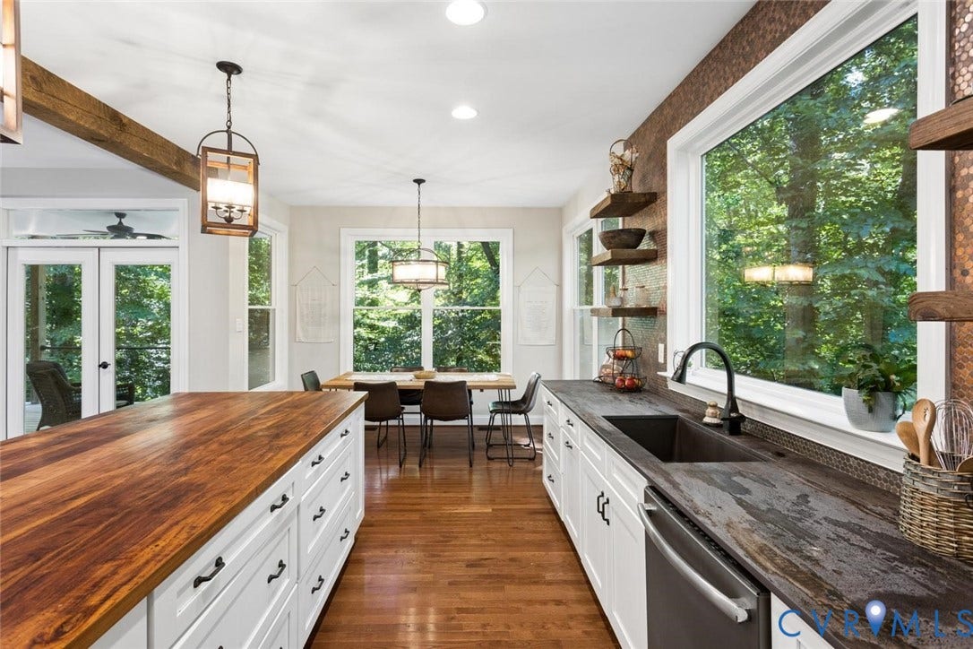 9013 Old Holly Road, Southhampton, Richmond, VA 23235 Kitchen featuring wood-finish flooring, white cabinetry with dark hardware, a wood-finish island countertop, and a dark stone-finish perimeter countertop