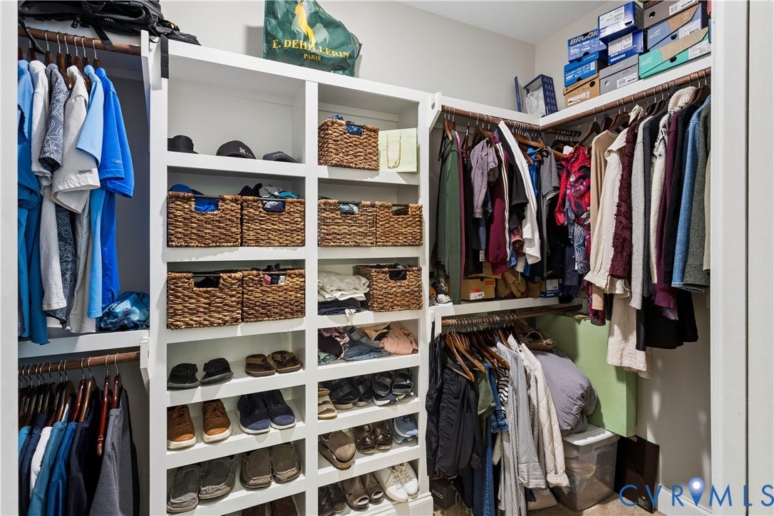 9013 Old Holly Road, Southhampton, Richmond, VA 23235 Custom built-in closet system featuring multiple hanging rods, integrated shelving, and dedicated shoe storage