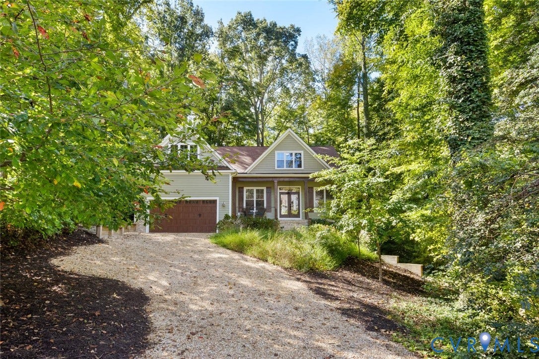9013 Old Holly Road, Southhampton, Richmond, VA 23235 Gabled residence with light green siding, a brown garage door, and a covered porch