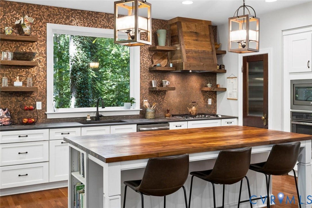 9013 Old Holly Road, Southhampton, Richmond, VA 23235 Kitchen featuring a custom wood range hood, copper-toned mosaic tile backsplash, solid wood island countertop, white shaker cabinetry, and black hardware