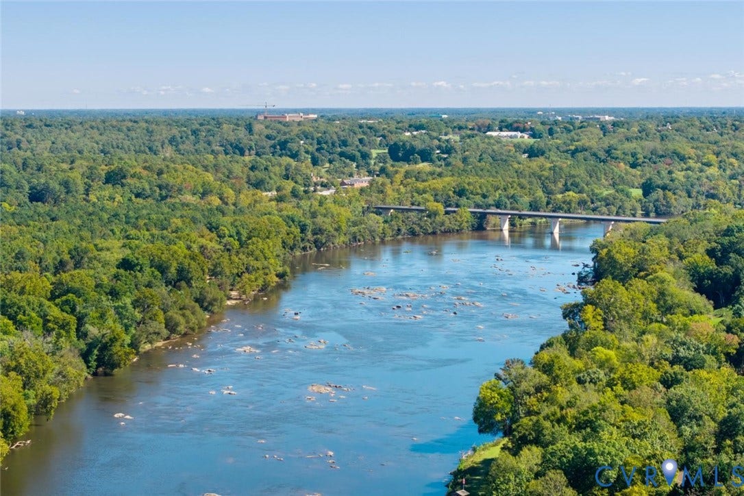 9013 Old Holly Road, Southhampton, Richmond, VA 23235 Expansive natural surroundings featuring a wide river, dense tree canopy, and a prominent bridge structure