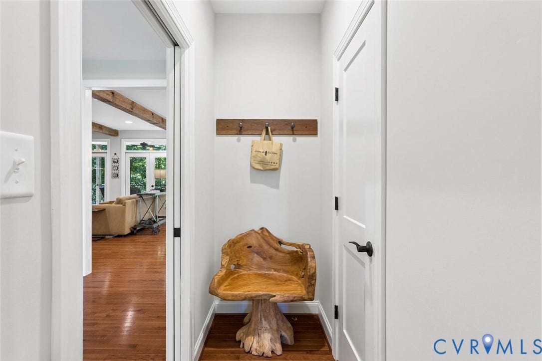 9013 Old Holly Road, Southhampton, Richmond, VA 23235 Warm wood flooring throughout, light gray wall finishes, and a contrasting dark door handle
