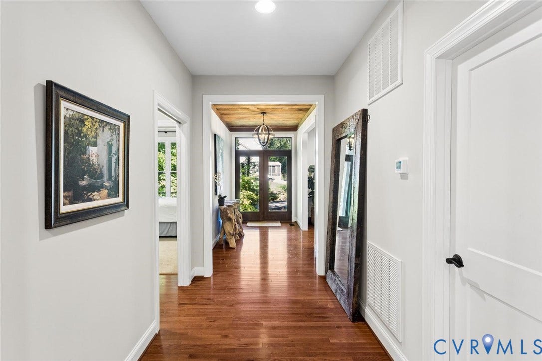 9013 Old Holly Road, Southhampton, Richmond, VA 23235 Hallway featuring wood-finish flooring, white paneled doors with matte black hardware, and recessed lighting