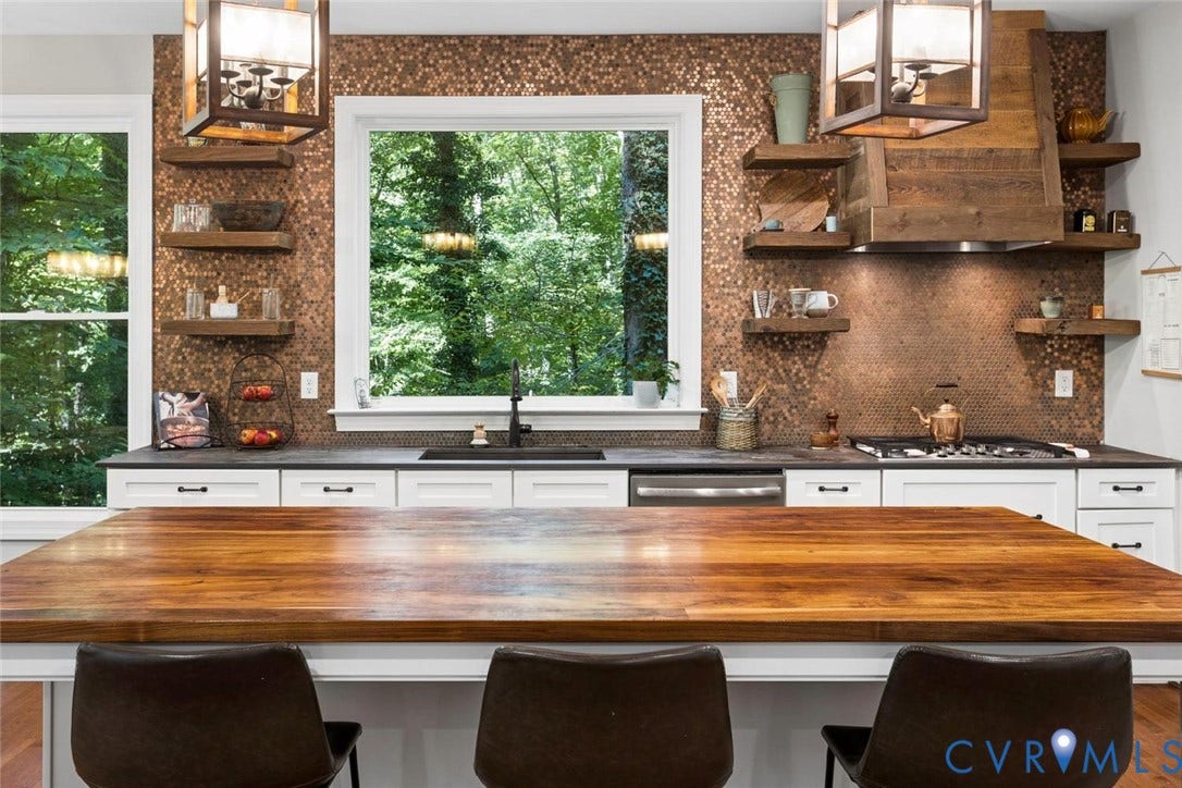 9013 Old Holly Road, Southhampton, Richmond, VA 23235 Hardwood island countertop, bronze penny tile backsplash, white shaker cabinetry, stainless steel range with wooden hood, and open shelving