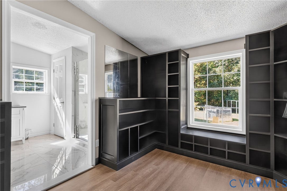 8211 Brills Road, Dinwiddie, VA 23872 Built-in shelving with window seating, engineered wood flooring, and white trim