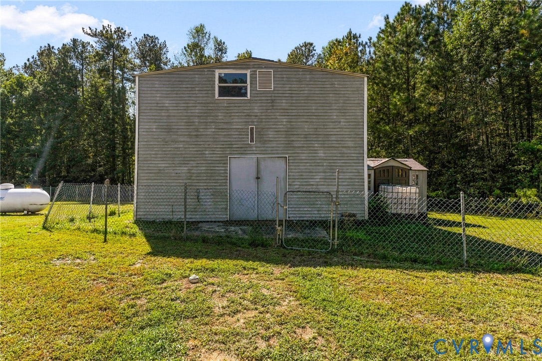 8211 Brills Road, Dinwiddie, VA 23872 Metal-sided auxiliary structure with upper-level window and ground-level double doors