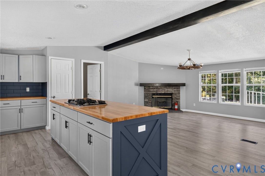 8211 Brills Road, Dinwiddie, VA 23872 Kitchen island with a wooden countertop and integrated cooktop