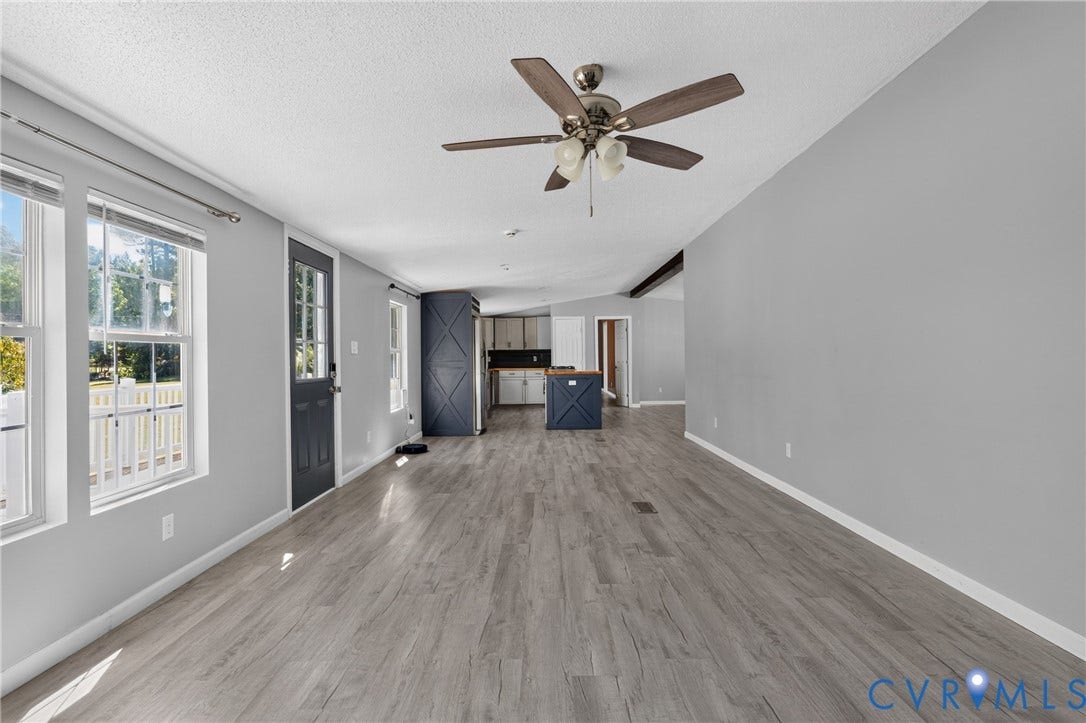 8211 Brills Road, Dinwiddie, VA 23872 Open-concept living space featuring wood-finish flooring, recessed lighting, and a ceiling fan