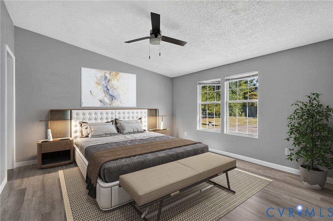 8211 Brills Road, Dinwiddie, VA 23872 Vaulted ceiling with a ceiling fan, wood-finish flooring, and multiple windows