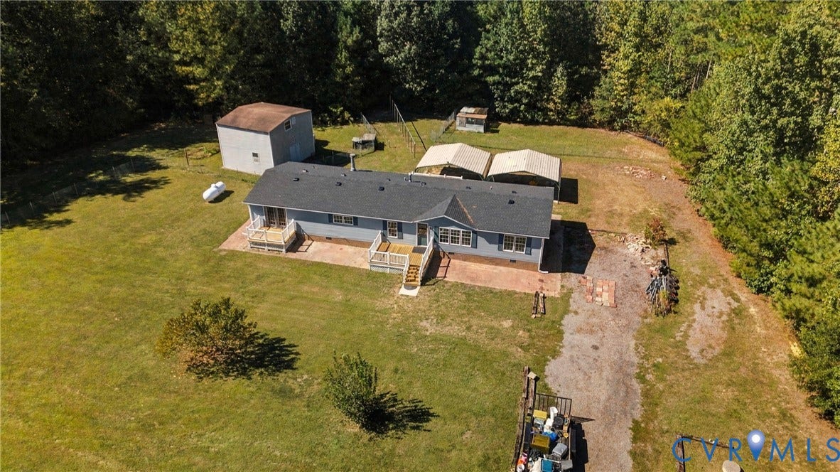8211 Brills Road, Dinwiddie, VA 23872 Single-story residence with a gray shingle roof and light blue siding