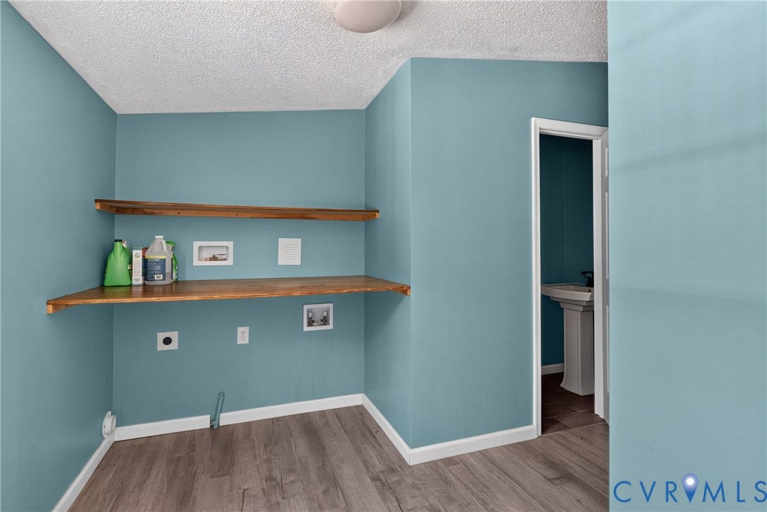 8211 Brills Road, Dinwiddie, VA 23872 Wood-finish flooring, two natural wood shelves, and a ceiling-mounted light fixture
