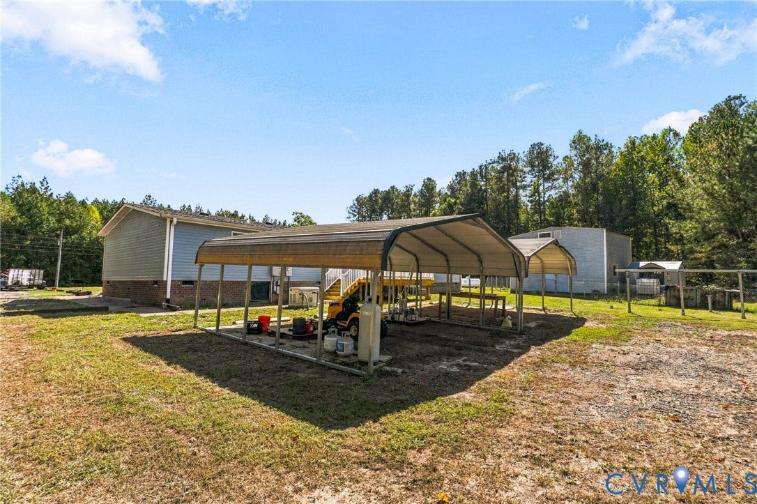 8211 Brills Road, Dinwiddie, VA 23872 Two metal frame canopies providing covered outdoor space