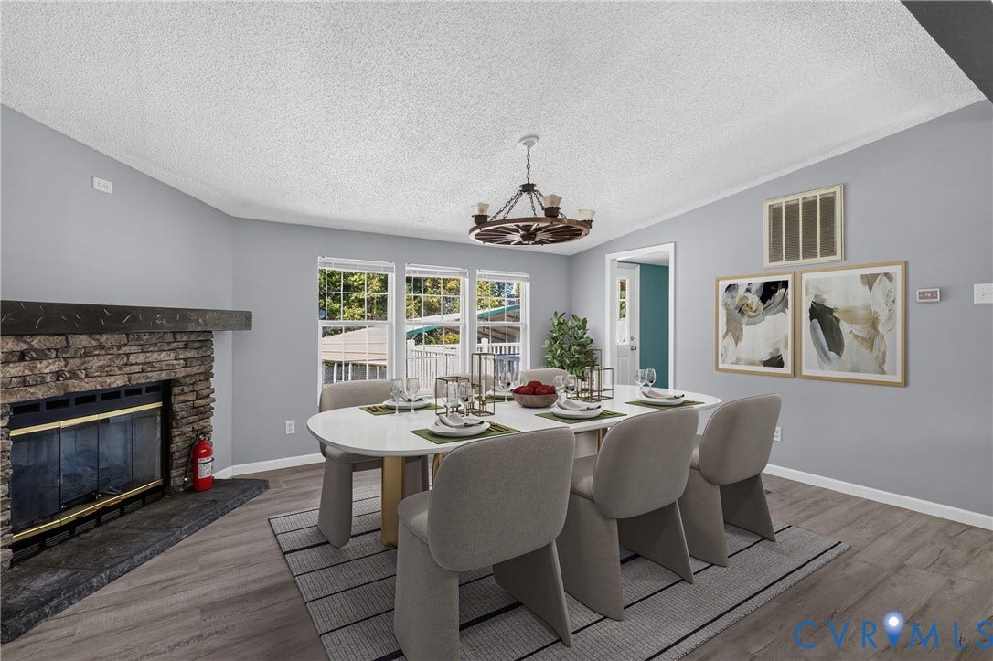 8211 Brills Road, Dinwiddie, VA 23872 Stacked stone fireplace with a dark wood-finish mantel