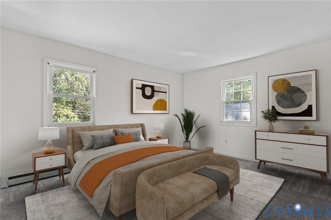 Neutral wall paint, two single-hung windows, and carpet flooring. Photo digitally staged.