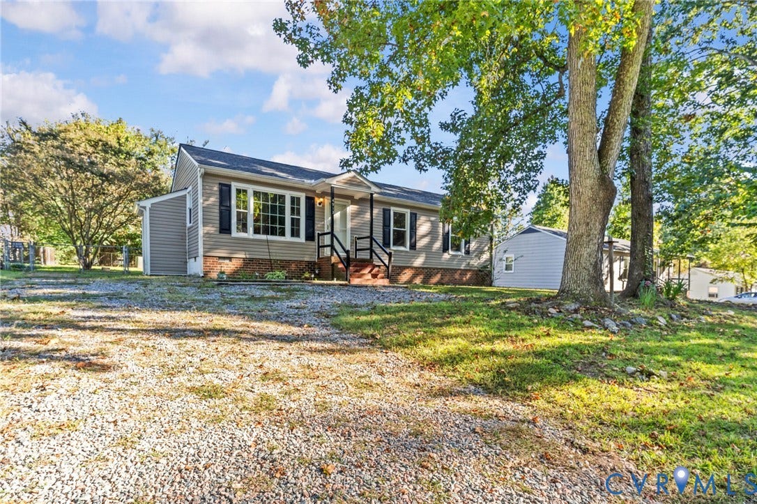 Gravel driveway provides ample parking