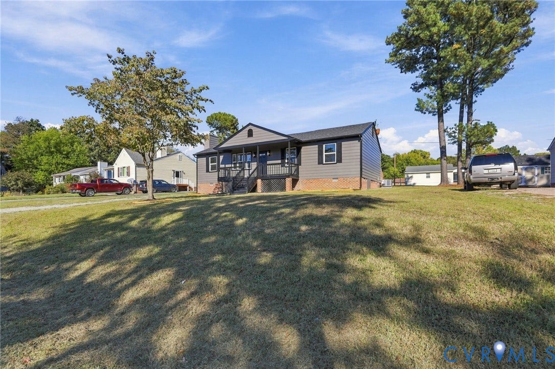 5113 Olympic Lane, North Dinwiddie, VA 23803 Gable roofline home with gray siding and white trim