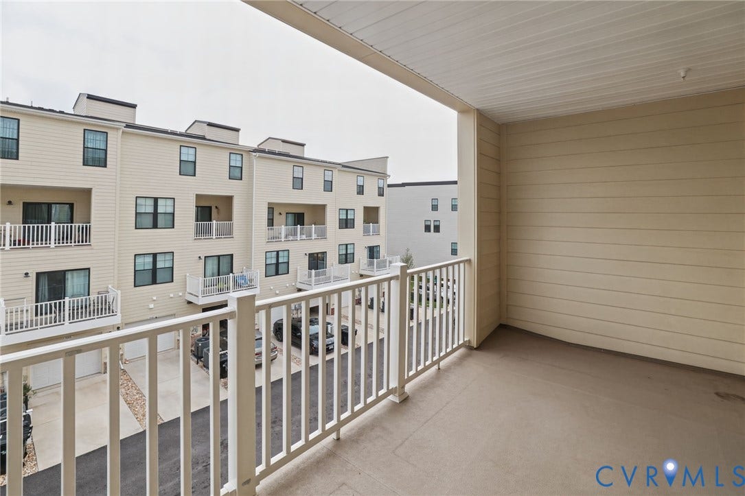 597 Weaver Brook Walk, #B, Richmond, VA 23233 Covered balcony featuring horizontal lap siding, concrete flooring, and white railing