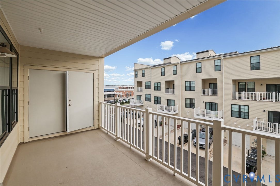 597 Weaver Brook Walk, #B, Richmond, VA 23233 Covered balcony featuring concrete flooring, white picket-style railings, and double-door access