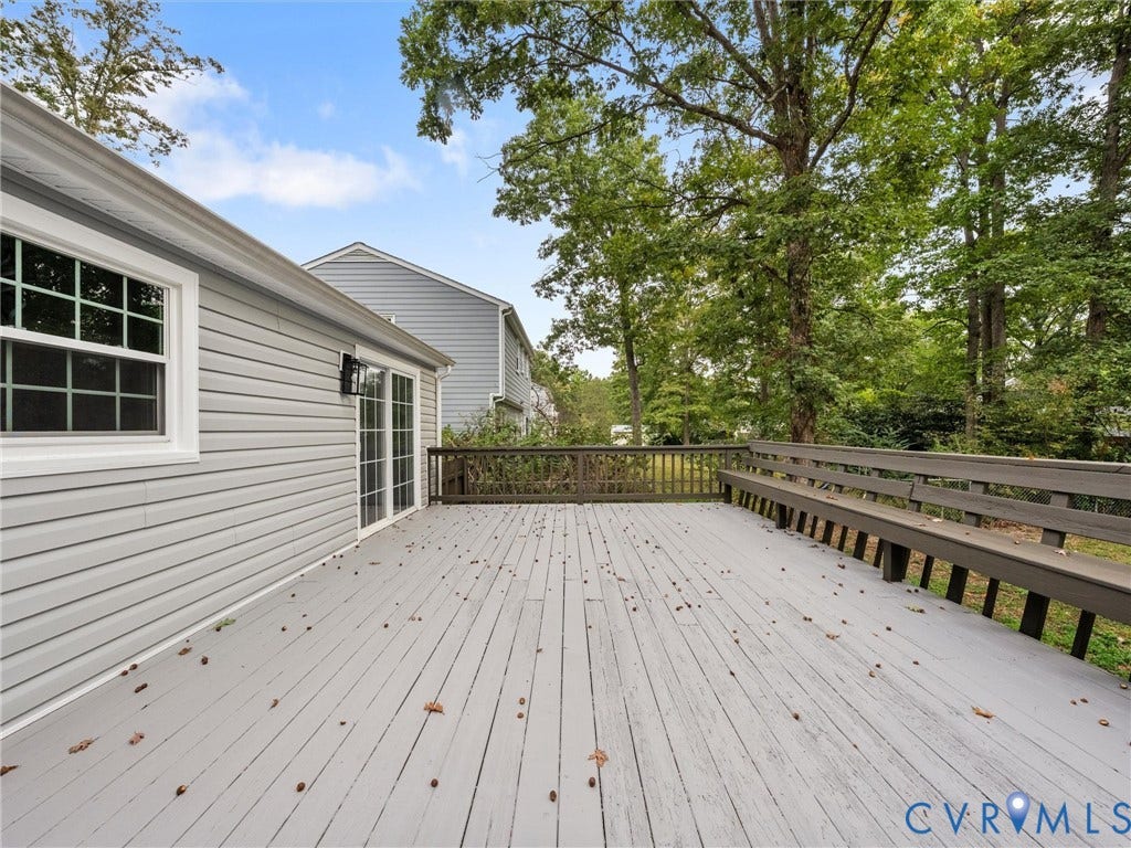 2031 Esquire Road, Midlothian, VA 23235 Spacious outdoor deck with integrated bench seating, featuring a wood-finish surface and direct access via sliding glass doors