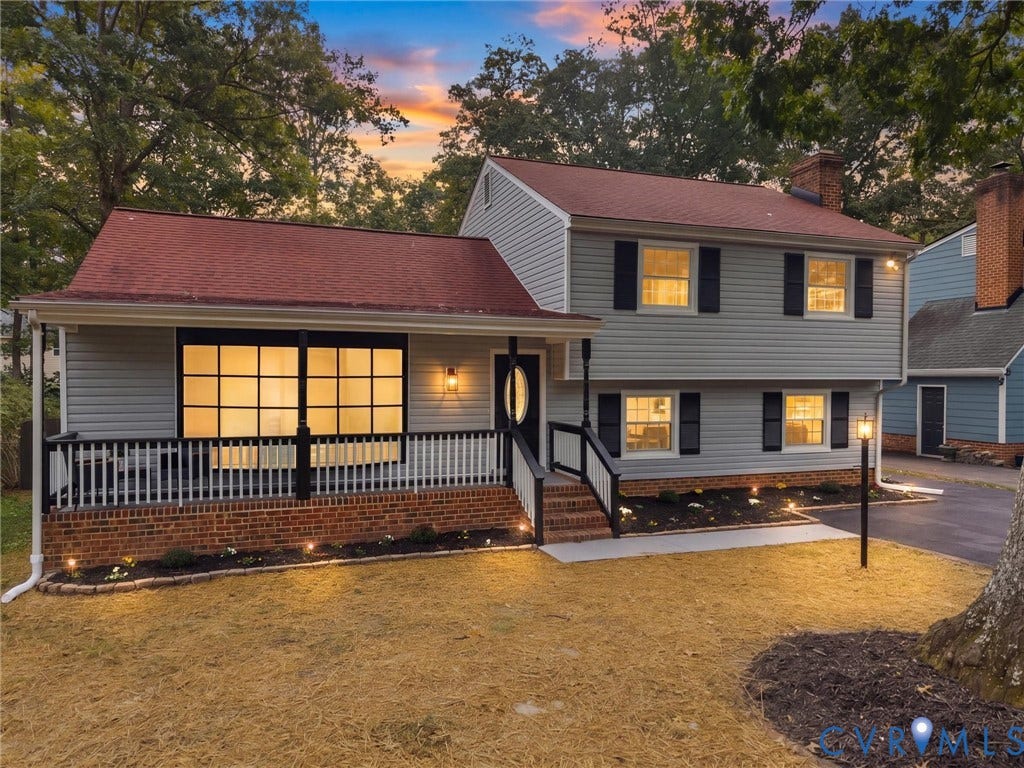 2031 Esquire Road, Midlothian, VA 23235 Split-level home featuring light gray siding, a red shingle roof, and dark shutters