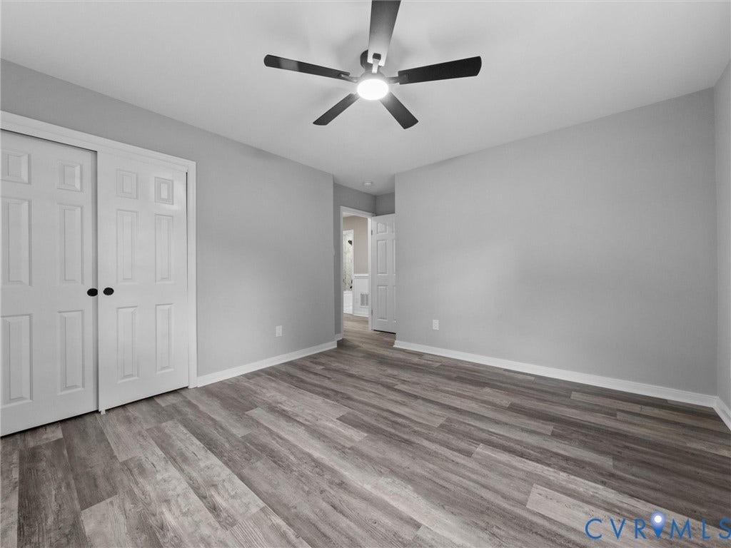 2031 Esquire Road, Midlothian, VA 23235 Wood-finish flooring throughout, bright walls, and a ceiling fan with integrated lighting