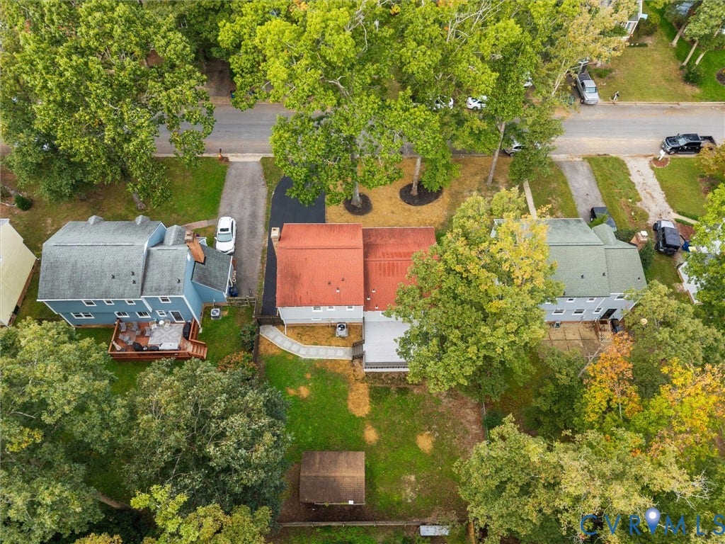 2031 Esquire Road, Midlothian, VA 23235 Red roof, surrounding trees, and a gravel driveway