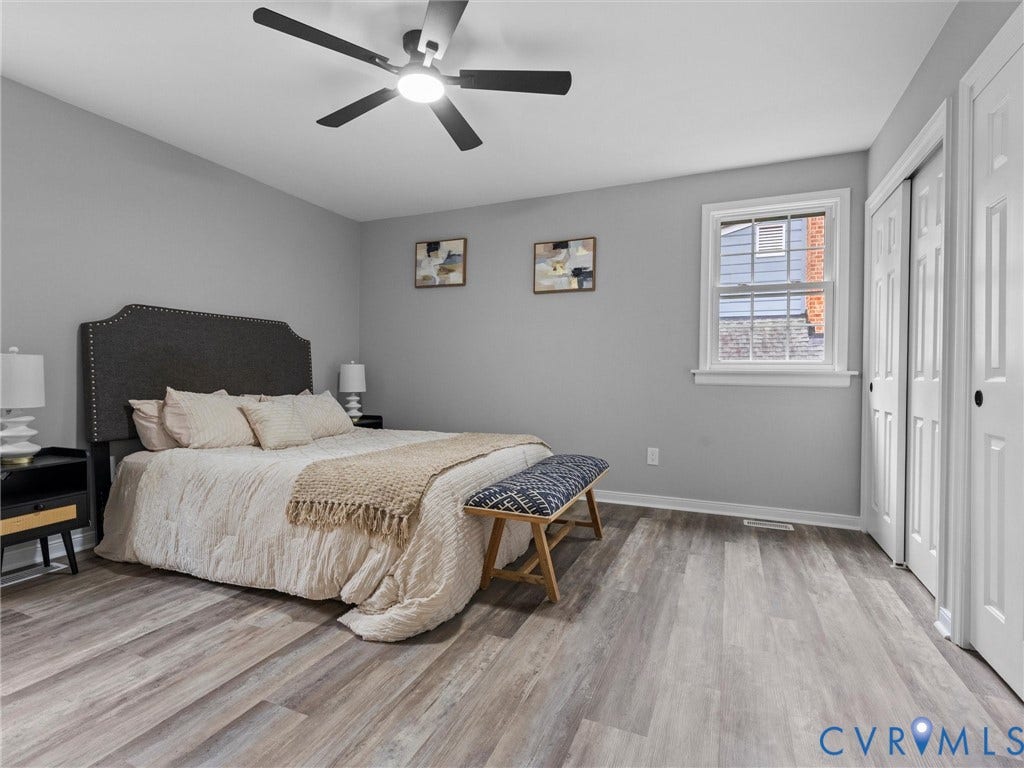 2031 Esquire Road, Midlothian, VA 23235 Wood-finish flooring, ceiling fan with light fixture, window with white trim, and bi-fold closet doors