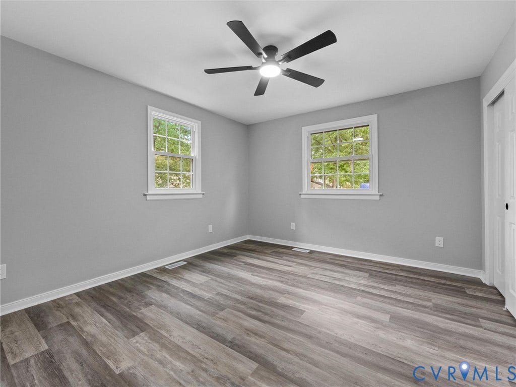 2031 Esquire Road, Midlothian, VA 23235 Wood-finish flooring, dual windows, ceiling fan with integrated lighting, neutral wall paint, and bi-fold closet doors